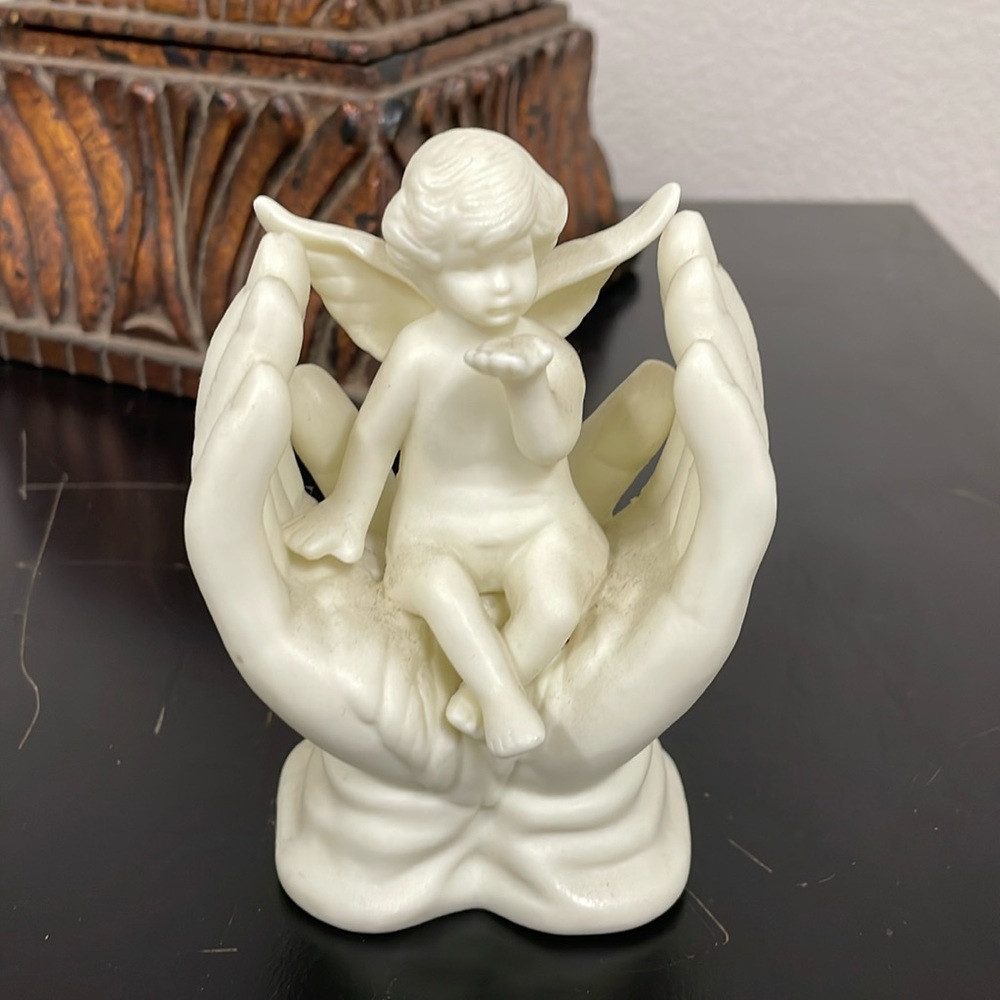 Home Decor. Ceramic Angel in hands.